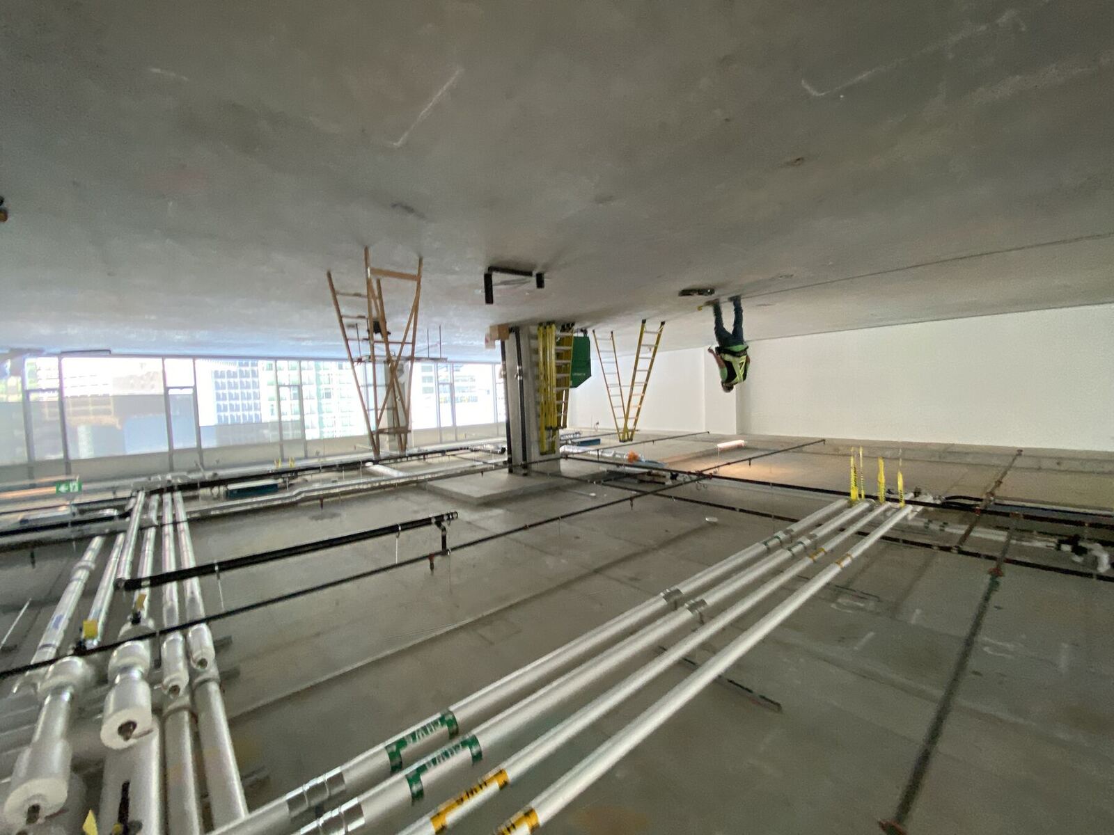 Mechanical and electrical rough-in on a concrete floor plate